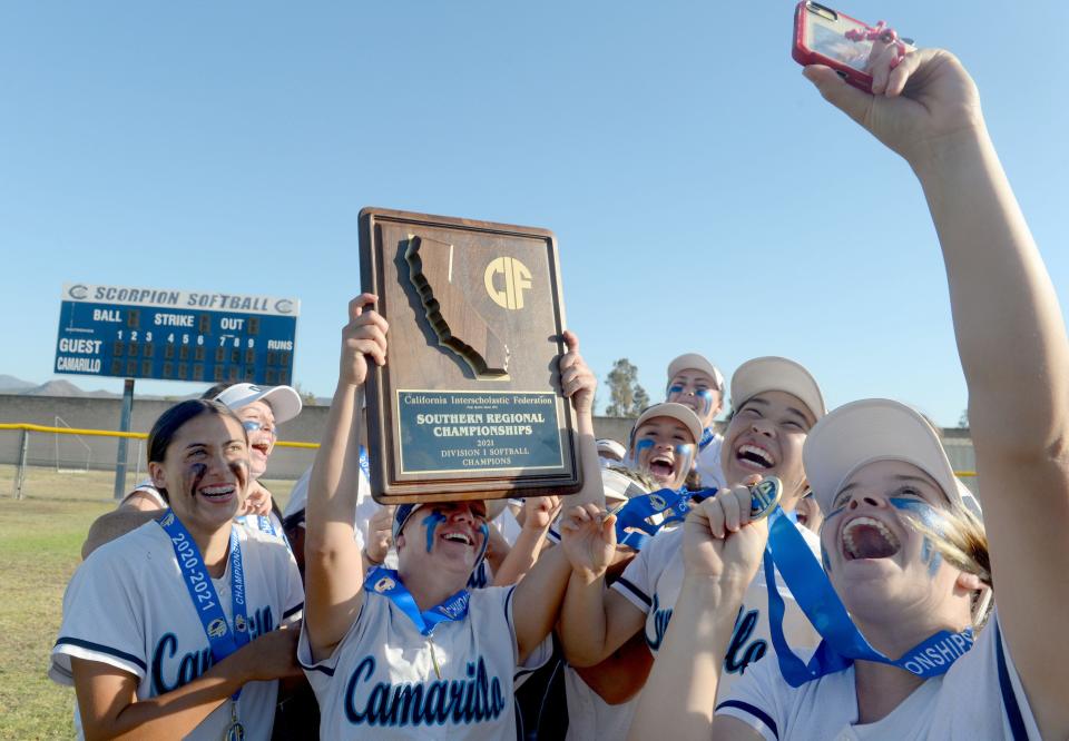 The Camarillo softball team shows off its CIF-State Division I SoCal Regional championship plaque on June 26.