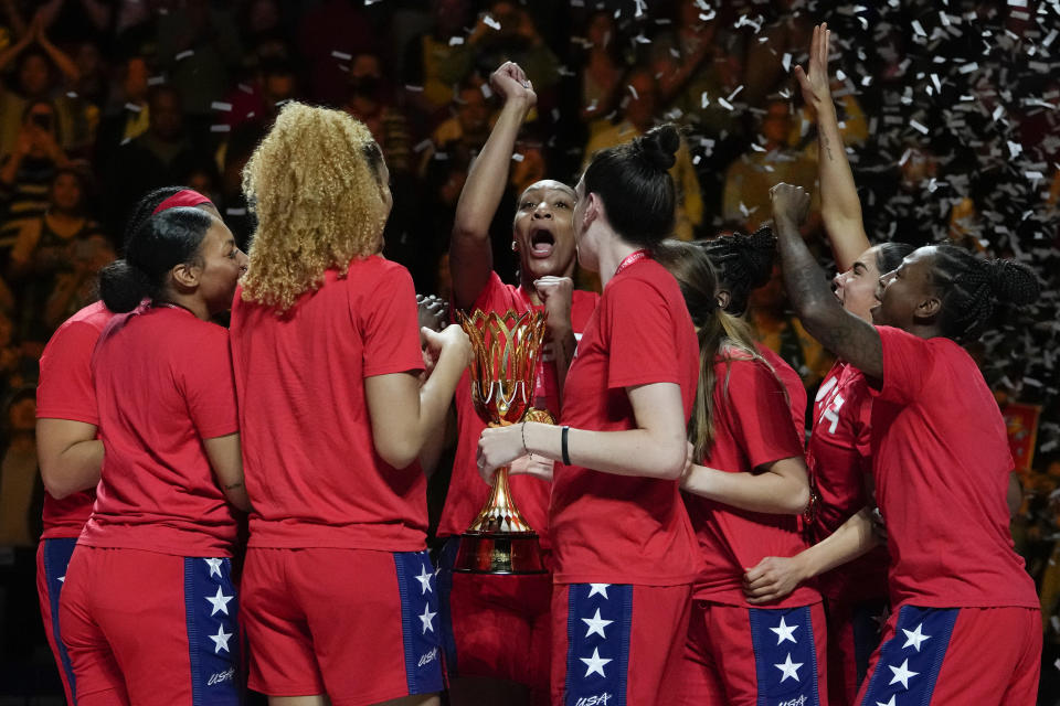 Gold medalists the United States celebrate on the podium after defeating China in the final at the women's Basketball World Cup in Sydney, Australia, Saturday, Oct. 1, 2022. (AP Photo/Mark Baker)