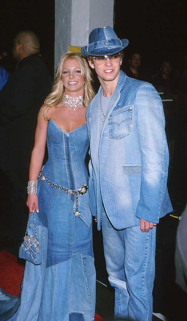 Britney Spears and Justin Timberlake wearing matching denim outfits on the red carpet