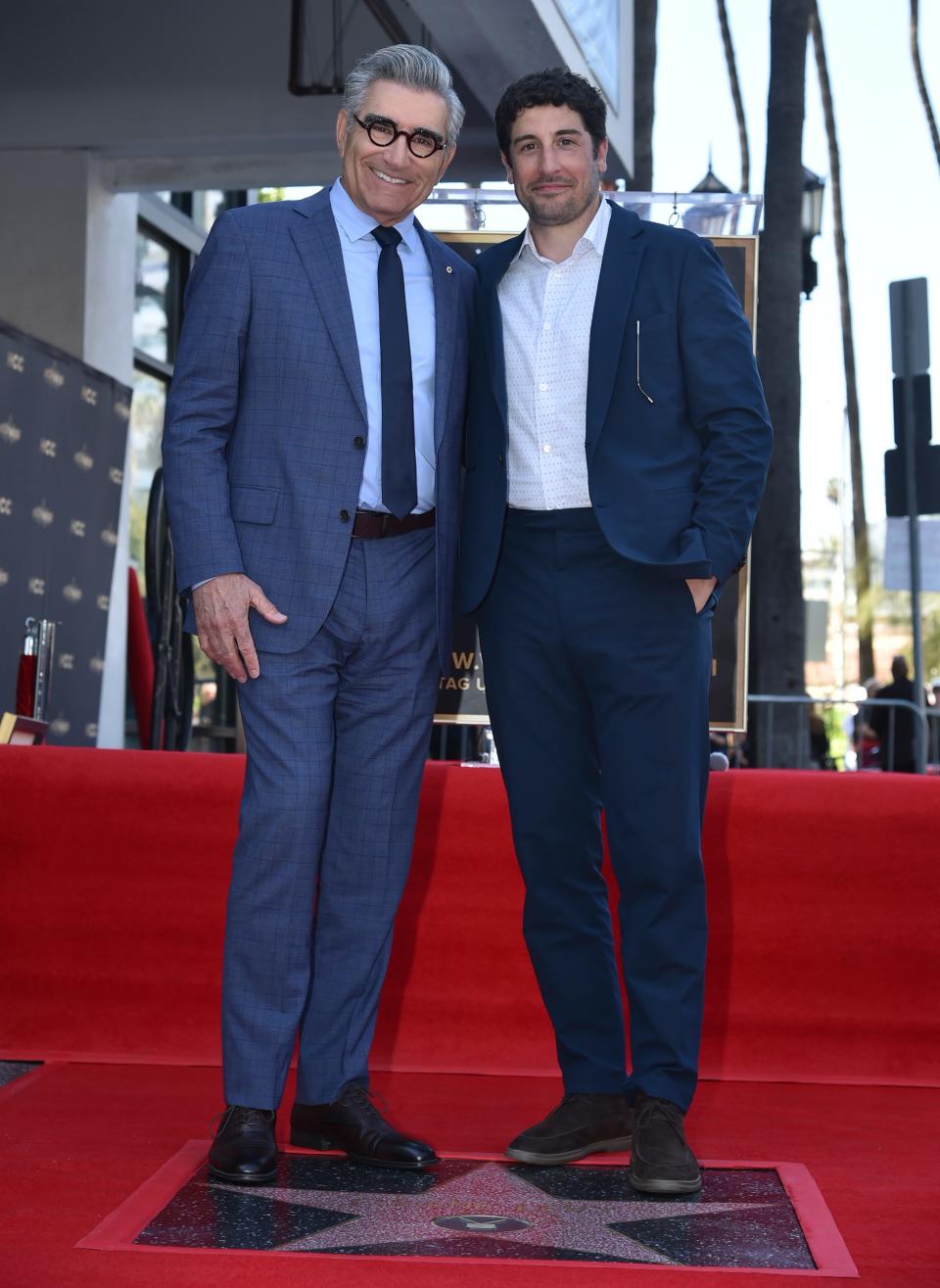 Eugene Levy poses with his "American Pie" son Jason Biggs at his Walk of Fame ceremony.