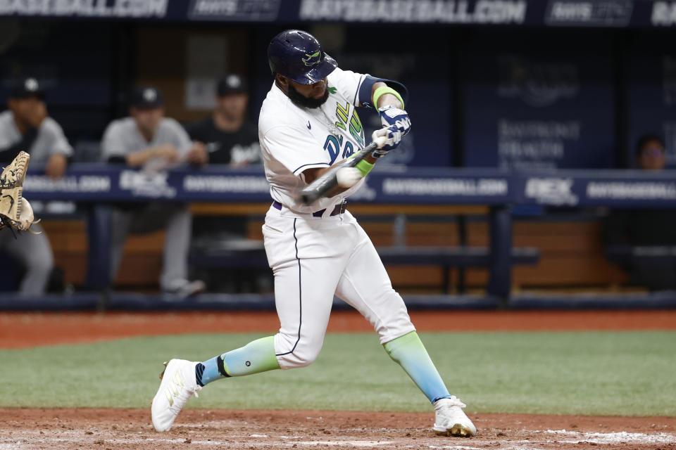 Tampa Bay Rays' Manuel Margot hits an RBI single against the New York Yankees during the eighth inning of a baseball game Saturday, May 28, 2022, in St. Petersburg, Fla. (AP Photo/Scott Audette)