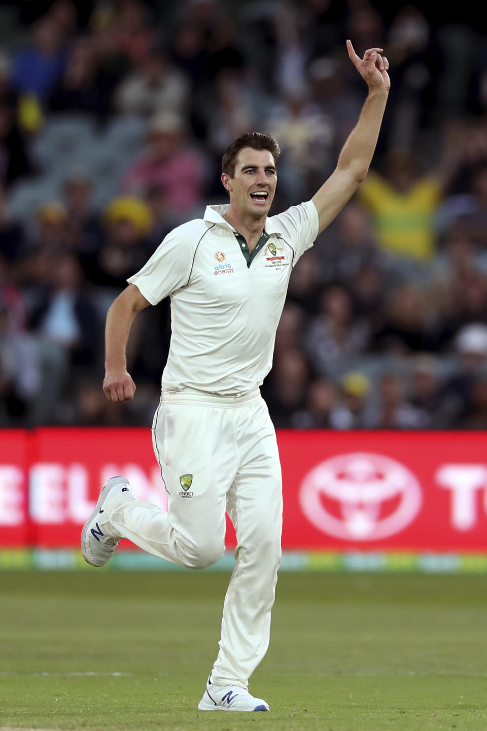 Australia's Pat Cummins celebrates the wicket of Pakistan's Azhar Ali during their cricket test match in Adelaide, Saturday, Nov. 30, 2019. (AP Photo/James Elsby)