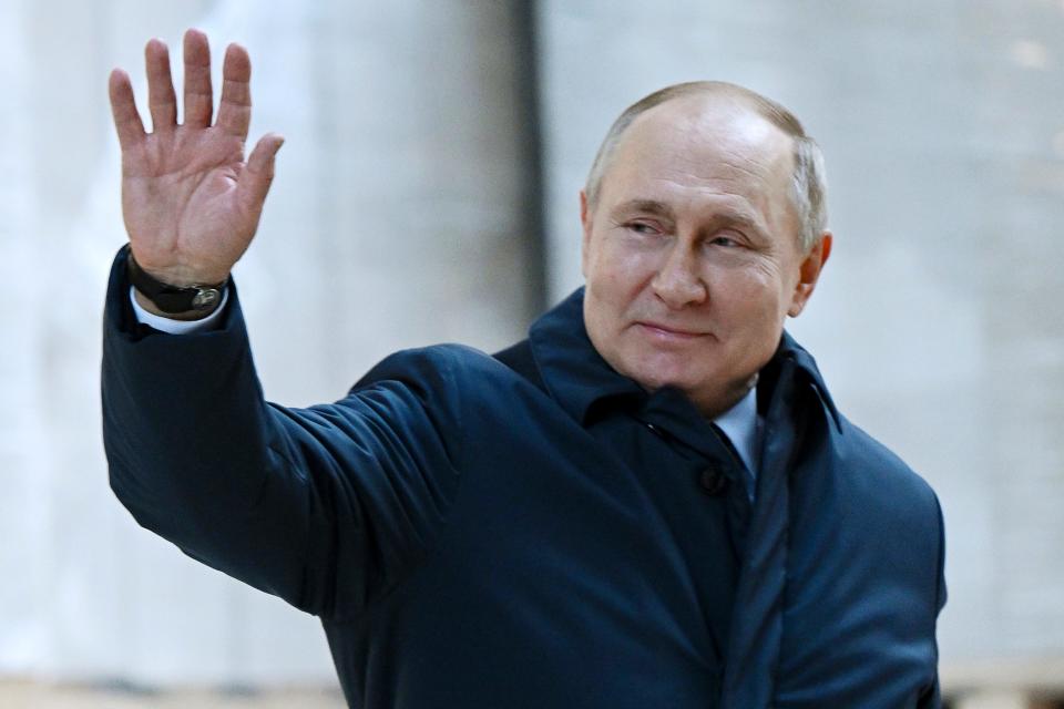 Russian President Vladimir Putin gestures as he leaves the construction site of the National Space Agency on the premises of the Khrunichev State Research and Production Space Centre in Moscow on Sunday.