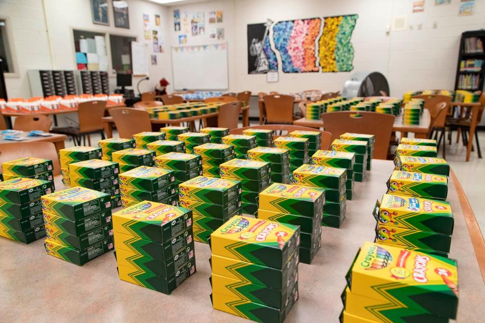 School supplies are stacked on tables in the media center at Heritage Elementary School in Greenacres.