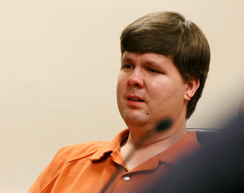 A tear rolls down the cheek of Justin Ross Harris, the father of a toddler who died after police say he was left in a hot car for about seven hours, as he sits during his bond hearing in Cobb County Magistrate Court, Thursday, July 3, 2014, in Marietta, Ga. Harris who police say intentionally killed his toddler son by leaving the boy inside a hot SUV was exchanging nude photos with women the day his son died and had looked at websites that advocated against having children, a detective testified Thursday. At that same hearing, a judge refused to grant bond for Harris, meaning he will remain in jail. (AP Photo/Marietta Daily Journal, Kelly J. Huff, Pool)