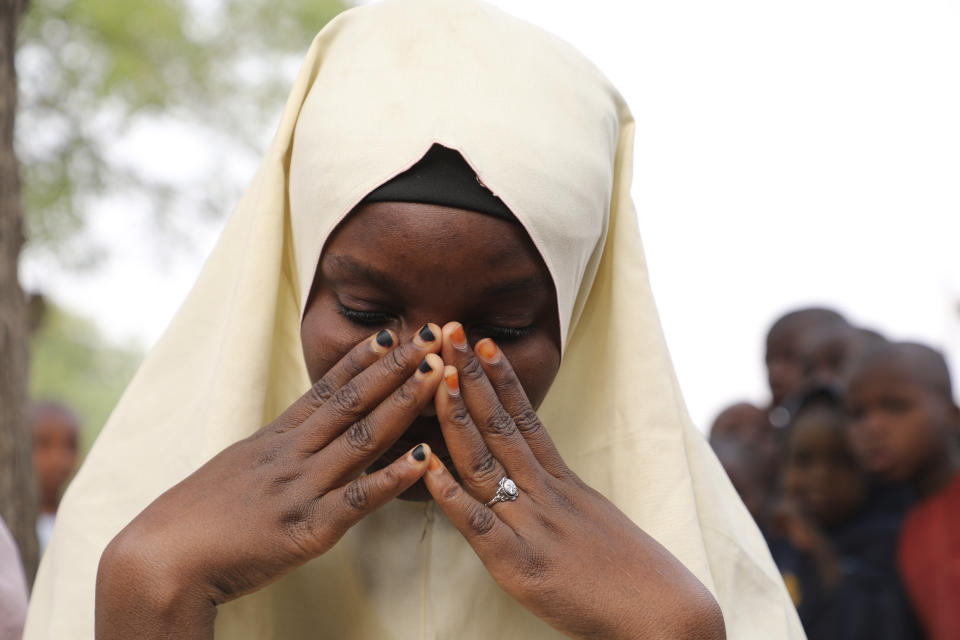 One of the students who was not kidnapped from a Government Girls Junior Secondary School following an attack by gunmen in Jangebe, Nigeria, Friday, Feb. 26, 2021. Gunmen abducted 317 girls from a boarding school in northern Nigeria on Friday, police said, the latest in a series of mass kidnappings of students in the West African nation. (AP Photo/ Ibrahim Mansur)