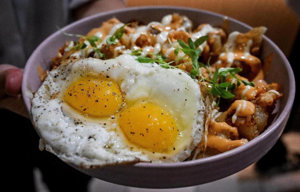 Patatas bravas — a potato dish with chipotle mayo and garlic aioli, sunnyside up eggs and chives — is served to customers during a test run for The Brunch Bar restaurant on Herndon and Willow avenues in Clovis on Tuesday, May 9, 2023.