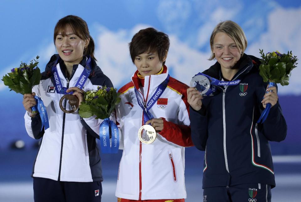 Women's 500-meter short track speedskating medalists, from left, South Korea's Park Seung-hi, bronze, China's Li Jianrou, gold, and Italy's Arianna Fontana, silver, pose with their medals at the 2014 Winter Olympics in Sochi, Russia, Thursday, Feb. 13, 2014. (AP Photo/Morry Gash)