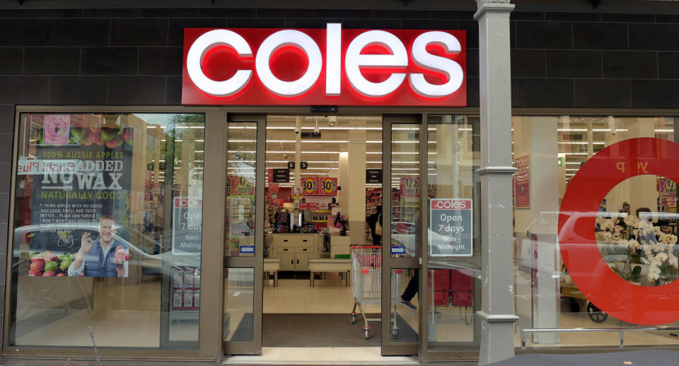 Photo shows the front of a Coles store. 