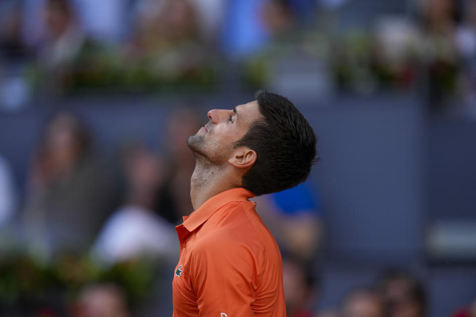 Novak Djokovic reacts during a men's semifinal match against Carlos Alcaraz at the Mutua Madrid Open tennis tournament in Madrid, Spain, Saturday, May 7, 2022. (AP Photo/Manu Fernandez)