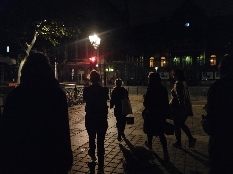 Women go to paste slogans on the Palais de Justice courthouse in Paris. About 300 women across France pasted slogans at the same time overnight from Sunday to Monday on courthouses in 27 different French cities to denounce the alleged inaction of the French government and demanding justice about femicides. (Photo: Kamil Zihnioglu/AP)