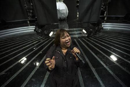 Rose Fostanes,47, a Filipina caregiver, performs during a rehearsal for Israel's X-Factor talent show in Tel Aviv January 12, 2014. REUTER/Baz Ratner