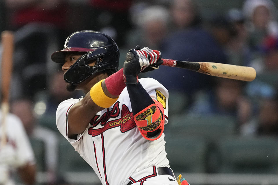 Atlanta Braves right fielder Ronald Acuna Jr. hits a triple in the first inning of a baseball game against the Los Angeles Dodgers, Monday, May 22, 2023, in Atlanta. (AP Photo/John Bazemore)