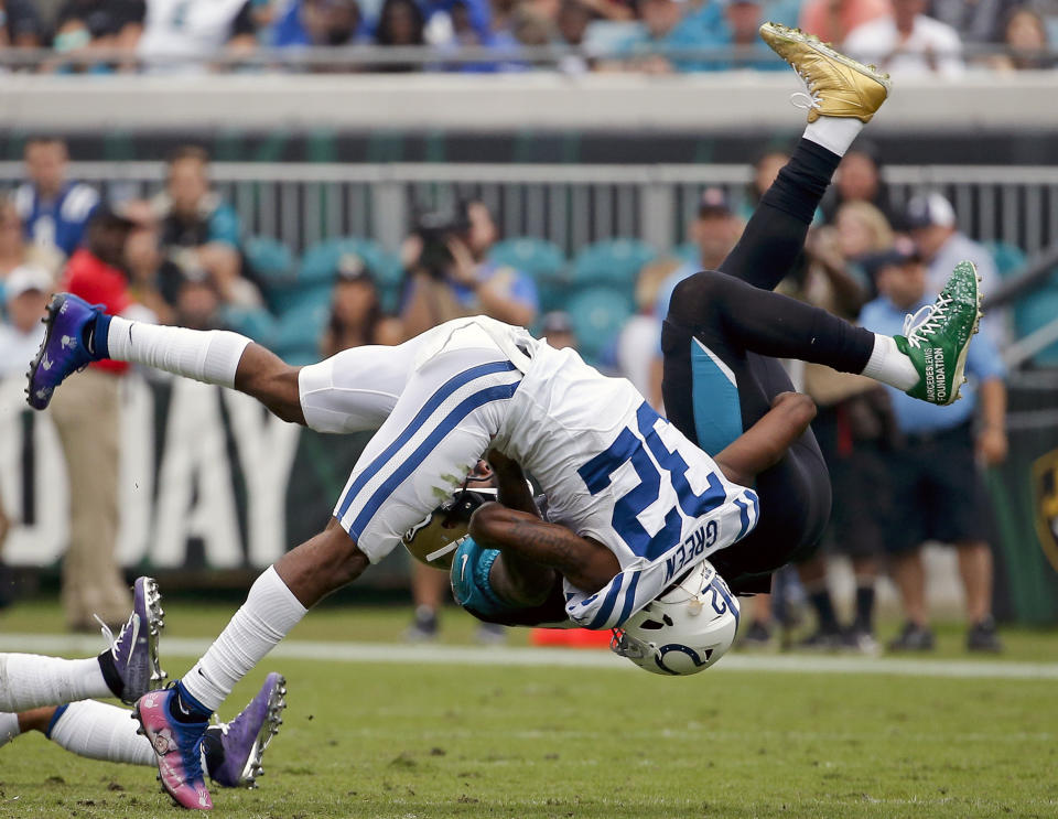 <p>Indianapolis Colts safety T.J. Green (32) flips Jacksonville Jaguars tight end Marcedes Lewis, right, after a reception during the second half of an NFL football game, Sunday, Dec. 3, 2017, in Jacksonville, Fla. (AP Photo/Stephen B. Morton) </p>