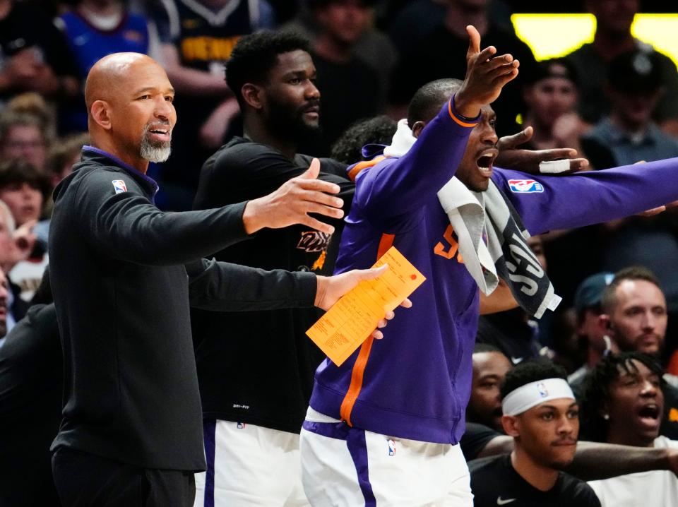 Phoenix Suns head coach Monty Williams and center Bismack Biyombo (18) react against the Denver Nuggets in the fourth quarter during Game 2 of the Western Conference Semifinals at Ball Arena in Denver on May 1, 2023.