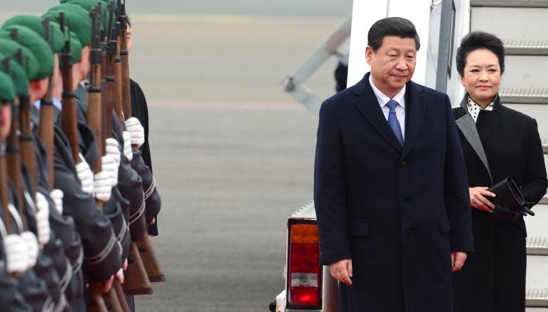 President Xi Jinping, seen here with his wife Peng Liyuan during a visit to Germany, has vowed a crackdown on official corruption within China