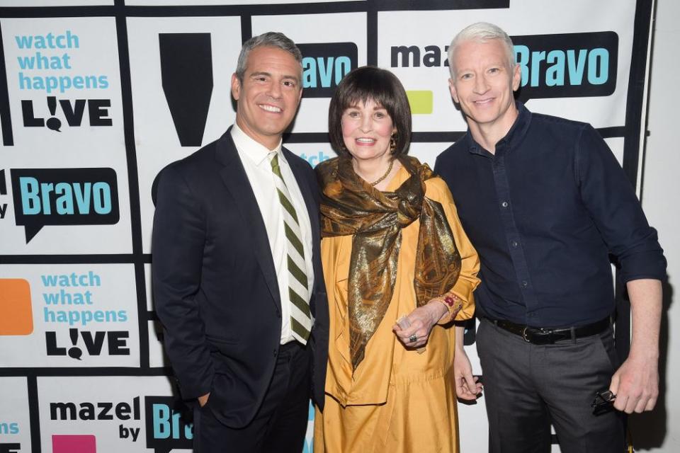 Andy Cohen (left) and Anderson Cooper with his mom Gloria Vanderbilt. | Charles Sykes/Bravo via Getty