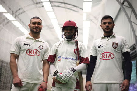 (L-R) Arman, 21 Mati, 22, and Haroon, 18, pose for a portrait at the cricket nets at the ground used by the Refugee Cricket Project (RCP) in south London, June 10, 2015. REUTERS/Shanshan Chen/Thomson Reuters Foundation