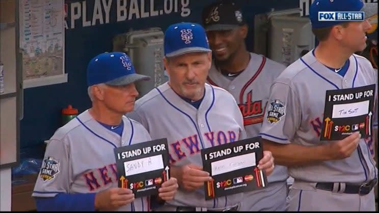 New York Mets manager Terry Collins supports Mets GM Sandy Alderson during Stand Up To Cancer promotion at All-Star game.