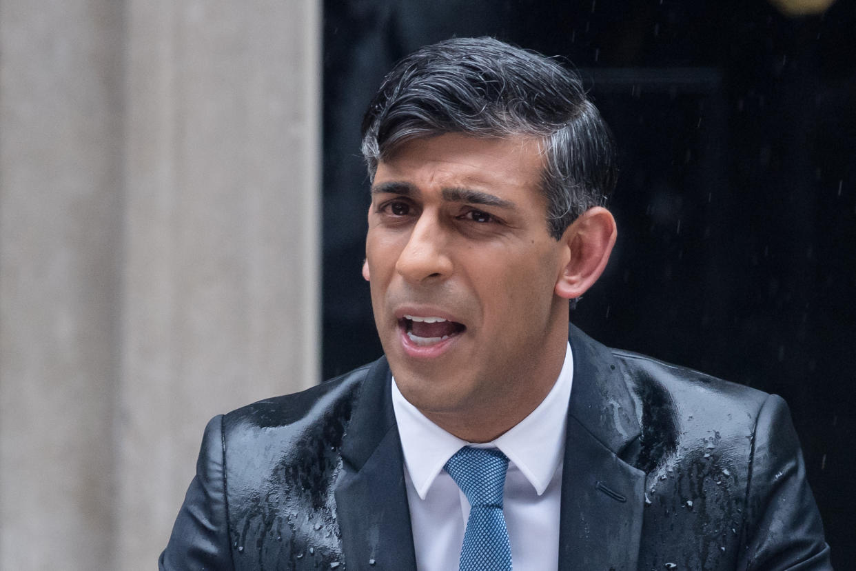 LONDON, UNITED KINGDOM - MAY 22: British Prime Minister Rishi Sunak makes a statement as raining outside 10 Downing Street announcing UK general election will take place on 4 July in London, United Kingdom on May 22, 2024. (Photo by Wiktor Szymanowicz/Anadolu via Getty Images)