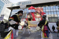 Dancers in traditional costumes perform to celebrate after the opening ceremony of the 2019 trading year at the Korea Exchange in Seoul, South Korea, Wednesday, Jan. 2, 2019. (AP Photo/Lee Jin-man)