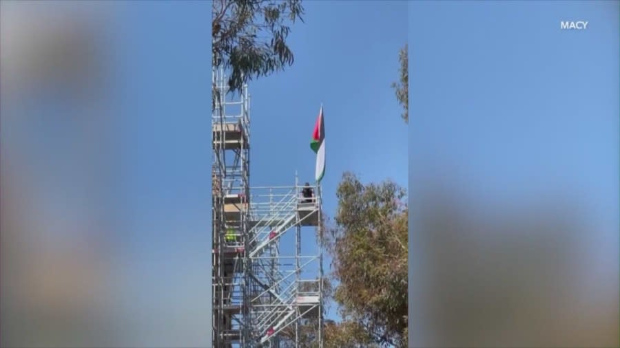 A Palestinian flag placed atop a building at UCLA by a demonstrator who scaled scaffolding. (Macy)