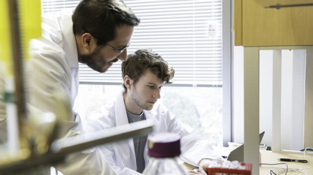 Researchers Jason McLellan and Daniel Wrapp work in the McLellan Lab at the University of Texas at Austin. (UT-Austin Photo / Vivian Abagiu)