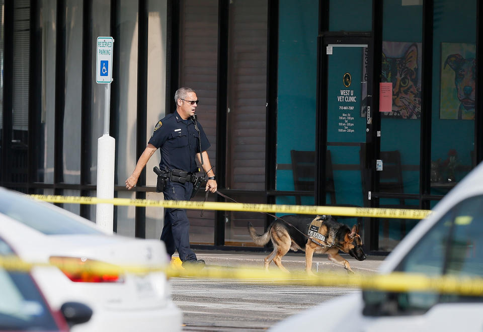 <p>Investigators looks over the scene where nine individuals were shot at a strip mall along Weslayan St. on September 26, 2016 in Houston, Texas. (Bob Levey/Getty Images)) </p>