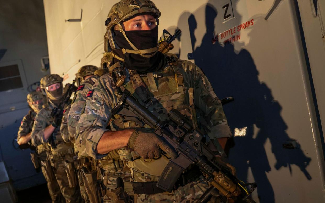 Royal Marines demonstrate boarding techniques on a Royal Navy warship in the Middle East. The Littoral Response Group (South) is in the Eastern Mediterranean