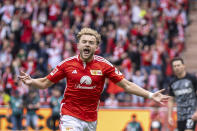 Union's Benedict Hollerbach celebrates after scoring their side's first goal of the game during the Bundesliga soccer match between Union Berlin and SC Freiburg at the Ander Alten Forsterei stadium in Berlin, Germany, Saturday May 18, 2024. (Andreas Gora/dpa via AP)