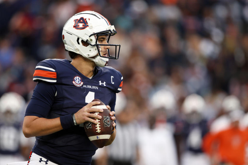 FILE - Auburn quarterback Payton Thorne looks to pass against Alabama during the first half of an NCAA college football game Saturday, Nov. 25, 2023, in Auburn, Ala. Auburn can cap coach Hugh Freeze’s first season back in the Southeastern Conference with a winning record by beating Maryland in the Music City Bowl. (AP Photo/Butch Dill, File)