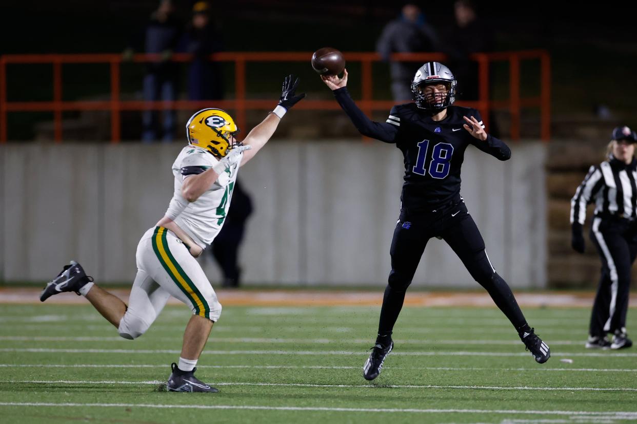 Hilliard Bradley’s Declan O’Neil throws a pass over Lakewood St. Edward’s Padraig McMahon during Friday night's state semifinal.