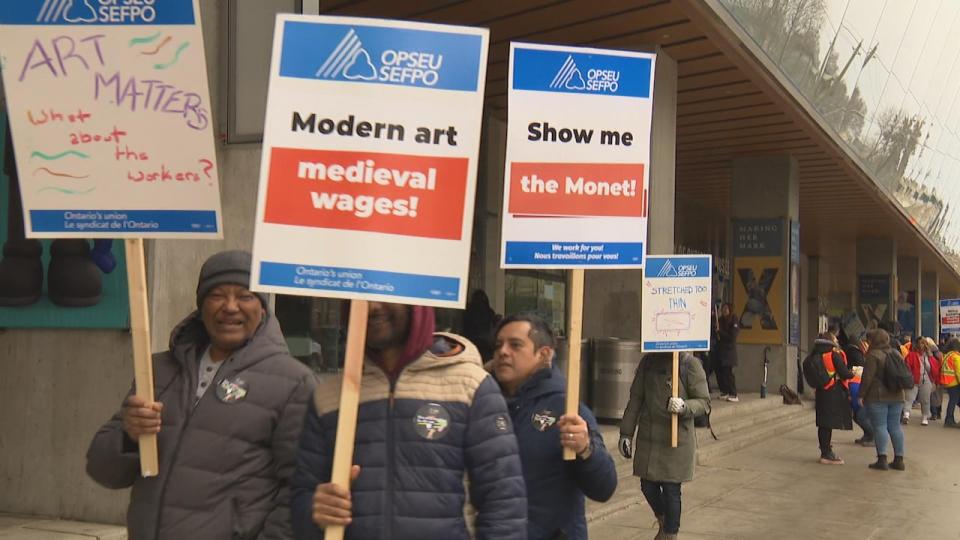 Somes of the signs seen at Tuesday's strike outside of the Art Gallery of Ontario.