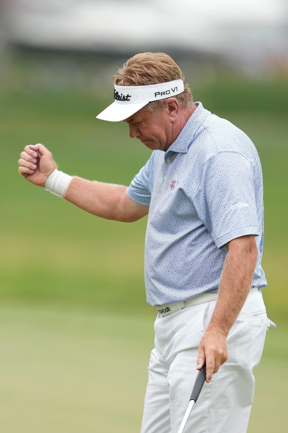 Paul Broadhurst celebrates after making a putt on the 18th green during the American Family Insurance Championship at University Ridge Golf Club on Saturday.