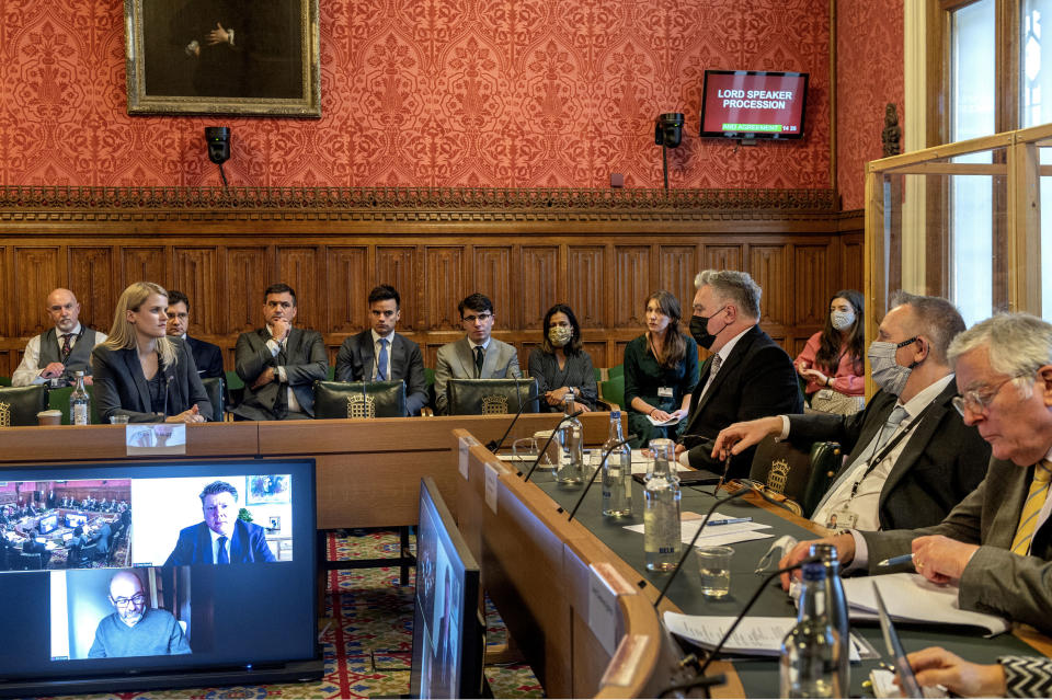 In this handout photo provided by UK Parliament, Facebook whistleblower Frances Haugen, second left, gives evidence to the joint committee for the Draft Online Safety Bill, as part of government plans for social media regulation, in London, Monday, Oct. 25, 2021. Haugen said Monday that Facebook is making online hate and extremism worse and outlined how it could improve online safety. (Annabel Moeller/UK Parliament via AP)