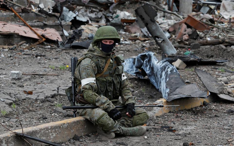 A Russian soldier takes a break while de-mining the Azovstal steel plant  - REUTERS/Alexander Ermochenko