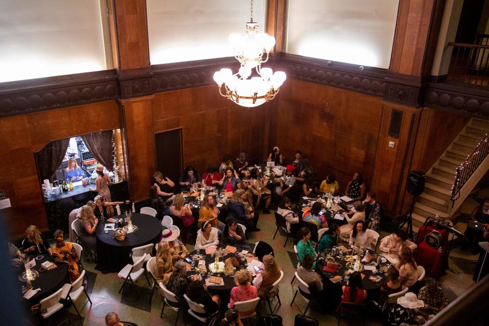 Attendees eat and mingle during The Vintage Ball fundraiser event put on by the A Step Ahead Foundation of West Tennessee inside the New Southern Hotel on Thursday, September 8, 2022, in Jackson, Tennessee. The event was an opportunity for women to come together dressed in their vintage attire while raising money for the foundation. 