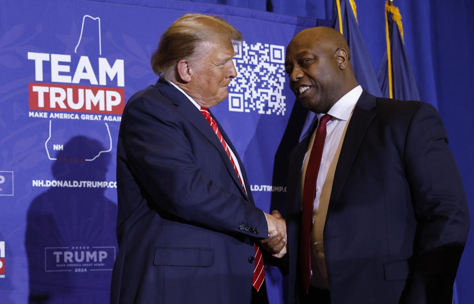 File: Sen. Tim Scott (R) (R-SC) shakes hands with Republican presidential candidate and former President Donald Trump during a campaign rally at the Grappone Convention Center on January 19, 2024 in Concord, New Hampshire.  / Credit: Chip Somodevilla / Getty Images