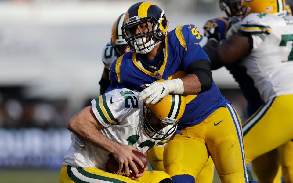 Aaron Donald sacks Aaron Rodgers in the Rams' 29-27 win over the Packers - AP