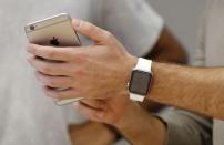 An Apple Watch is paired with an iPhone during a customer set up session at the company's flagship store in Sydney April 24, 2015. REUTERS/Jason Reed