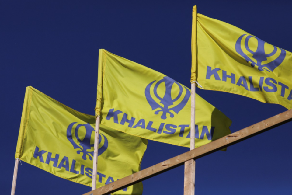 Blue and yellow flags of the Khalistan movement (Reuters)