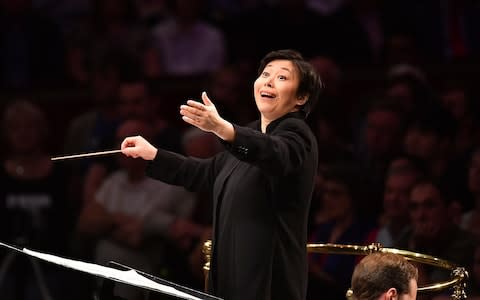 Xian Zhang conducts the BBC National Orchestra and Chorus of Wales and CBSO Chorus - Credit: Chris Christodoulou/BBC