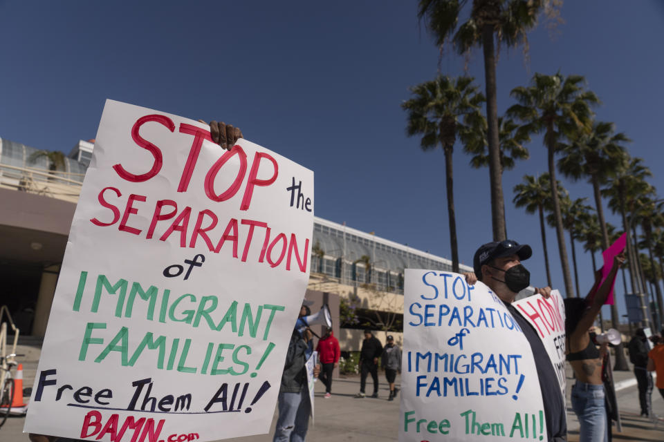 File— In this May 22, 2021 file photo, members of the Coalition to Defend Affirmative Action, Integration and Immigrant Rights, and Fight for Equality By Any Means Necessary, known as By Any Means Necessary (BAMN), hold a rally to demand the freedom of immigrant children in detention at a temporary shelter facility at the Long Beach Convention Center in Long Beach, Calif. U.S. Officials are closing four emergency facilities, two in Texas and two in California, set up to house migrant children caught crossing the border alone. But officials, Tuesday, June 29, 2021, cautioned that minors continue to arrive on the southwest border despite the summer heat. (AP Photo/Damian Dovarganes, File)