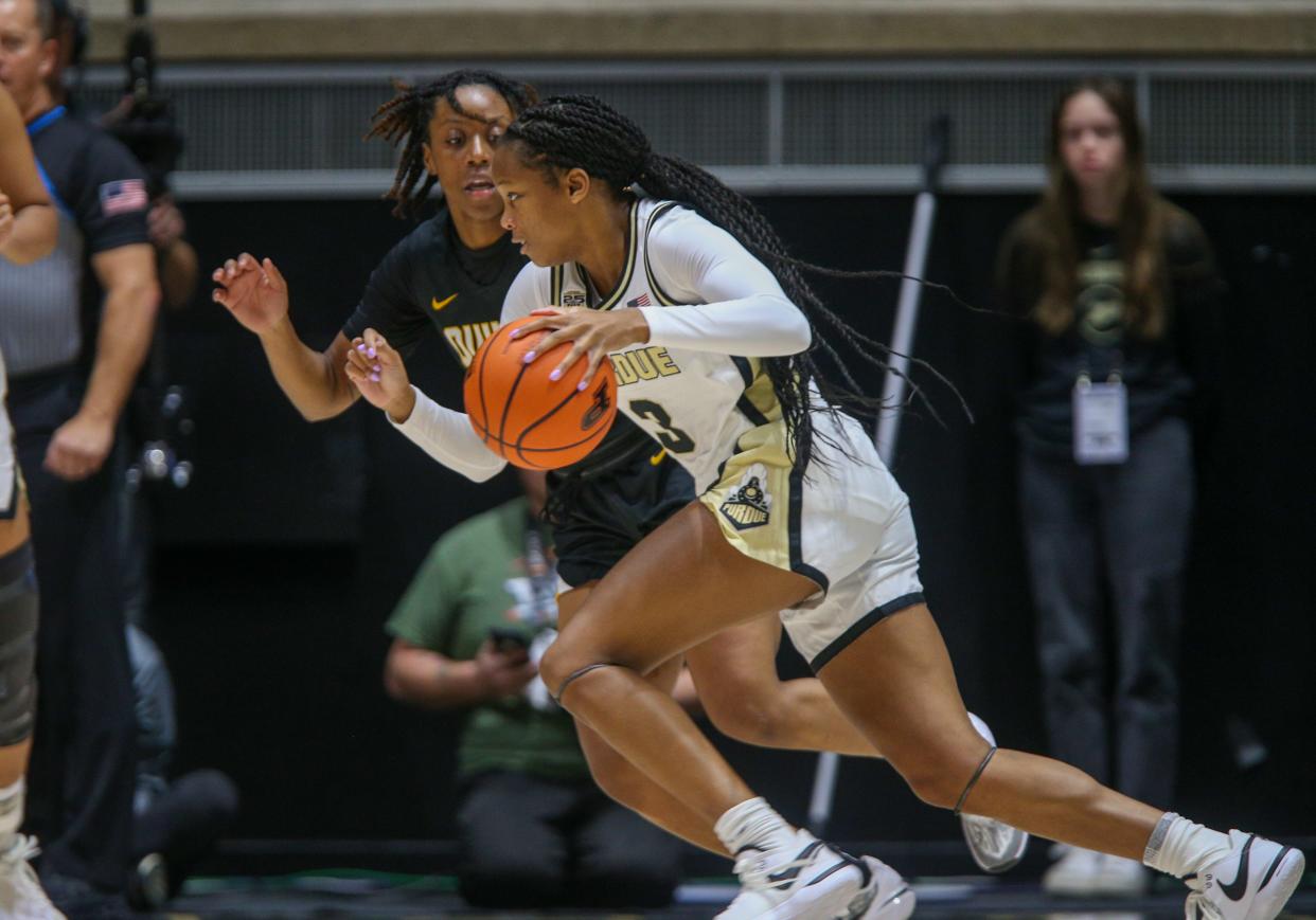 Purdue Boilermakers guard Jayla Smith (3) attempts to break pass Quincy Hawks forward Cymirah Williams (3) during the NCAA women's basketball game against the Quincy Hawks Sunday, Oct. 29, 2023, at Mackey Arena in West Lafayette, Ind