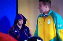 Michael Phelps mean mugs Chad Le Clos of South Africa before the Men’s 200m Butterfly Seminfinals.