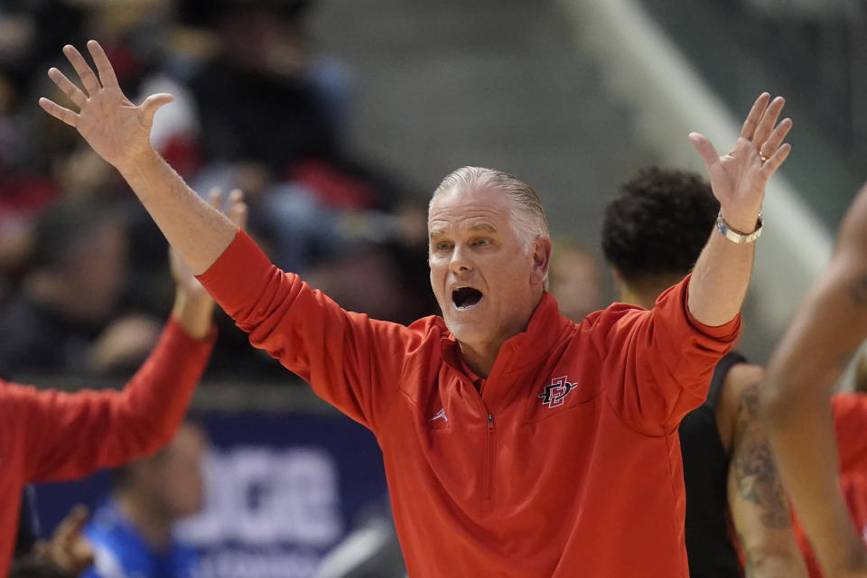 FILE - San Diego State coach Brian Dutcher reacts after a call during the first half of the team's NCAA college basketball game against BYU on Nov. 12, 2021, in Provo, Utah. (AP Photo/Rick Bowmer, File)