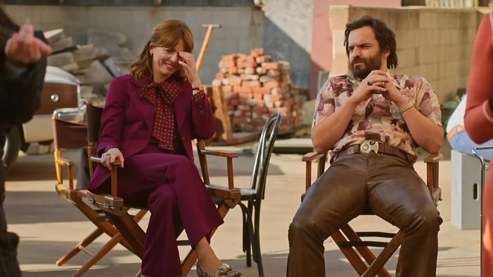 Ophelia Lovibond and Jake Johnson in chairs in Minx Season 1