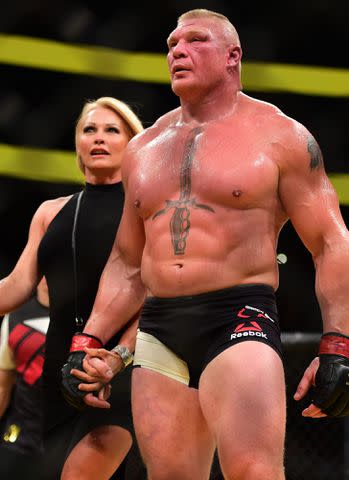 <p>Harry How/Zuffa LLC/Zuffa LLC/Getty</p> Brock Lesnar and Sable during the UFC 200 event in 2016