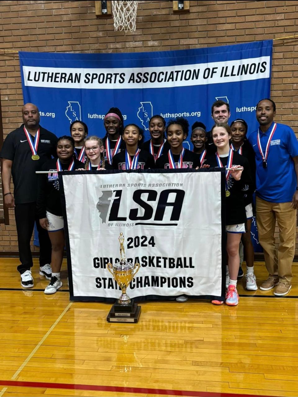Christ Lutheran won the 2024 Lutheran Sports Association of Illinois girls state basketball championship earlier this month. Former Manual standout Paris Gulley, far right, is the head coach.