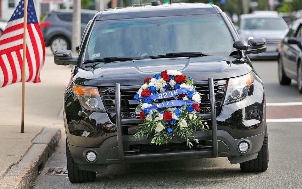 Braintree residents attend a funeral for Braintree K-9 officer Kitt on June 22, 2021. Kitt was killed in the line of duty.